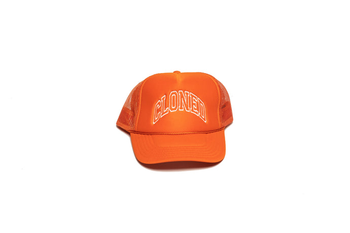 Orange Mesh trucker hat with Cloned embroidered in white collegiate letters in an Arc across the front panels, front view.